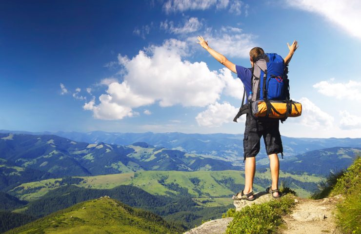 Tourist on peak. Sport and active life concept