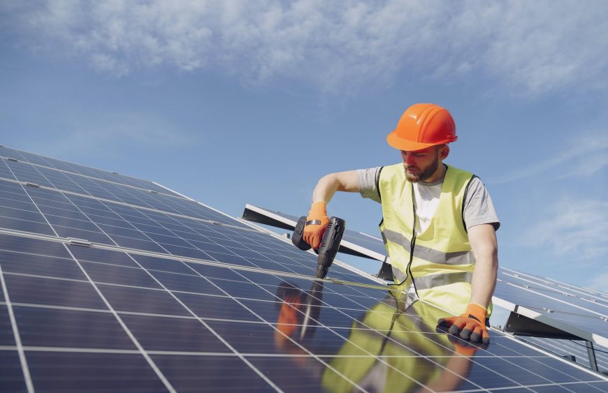 solar technician installing solar panel